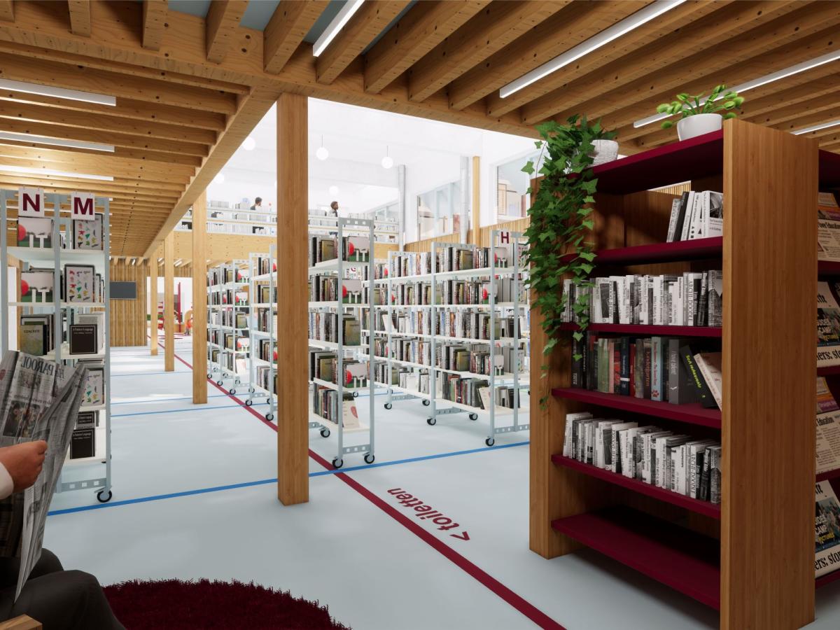 De nieuwe vleugel van de bib is een hoge, open ruimte met veel licht en plaats voor boeken. De rekken zijn gemaakt uit hergebruikte materialen.